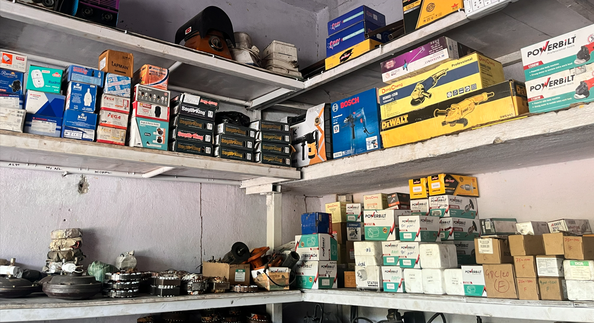 Shelves of power tools, motors, machine parts and electrical equipment in stock