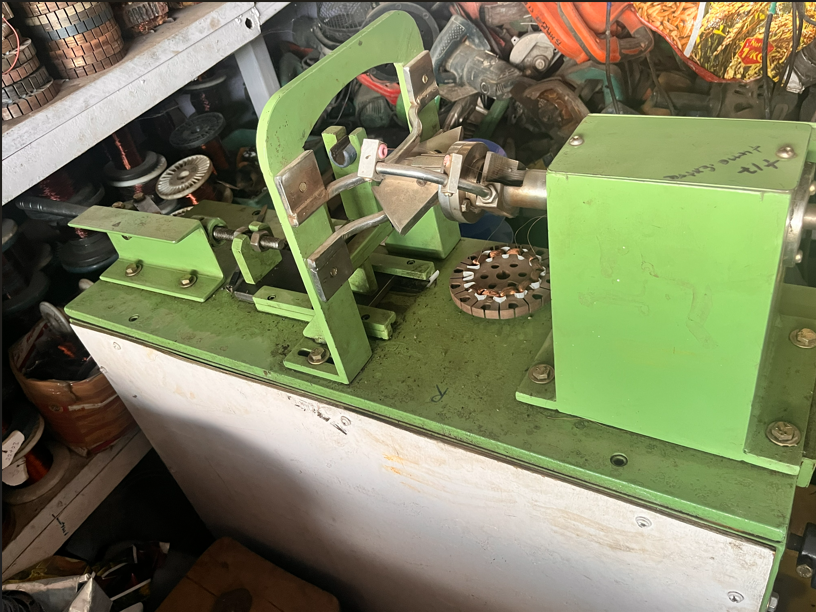 Motor coil winding machine in the Sharma Electrical Works workshop